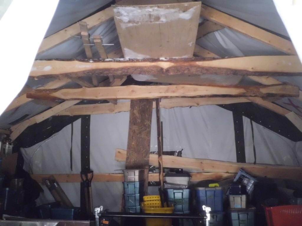 Rustic rafters in an army tent.