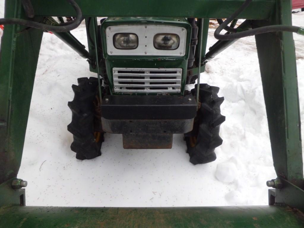 Front end closeup of Yanmar tractor in the snow.