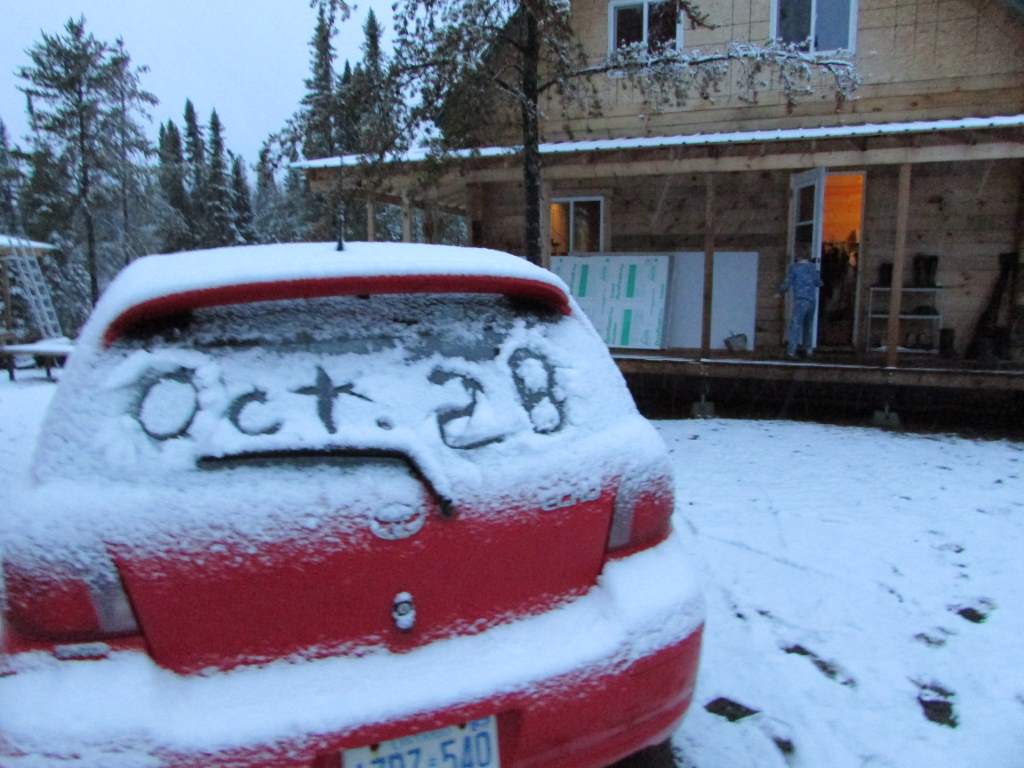 Car windscreen with "Oct 28" drawn in snow.
