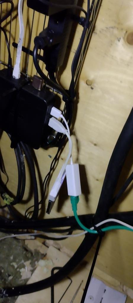 Cables plugged into the USB ports of a miniPC.