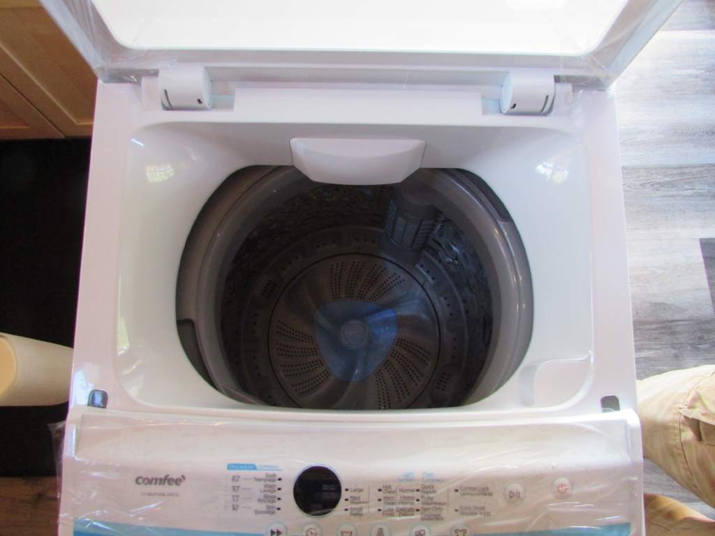 View inside apartment sized washing machine.