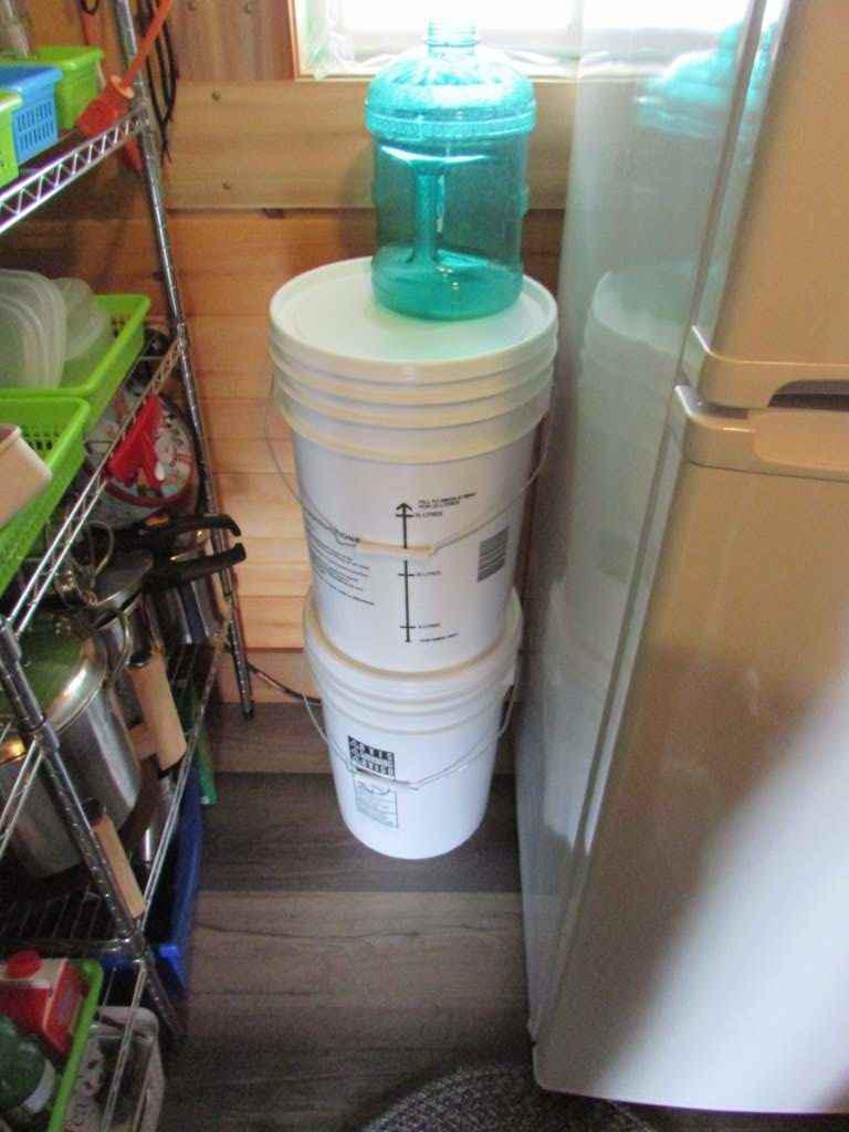 Two plastic pails stacked.